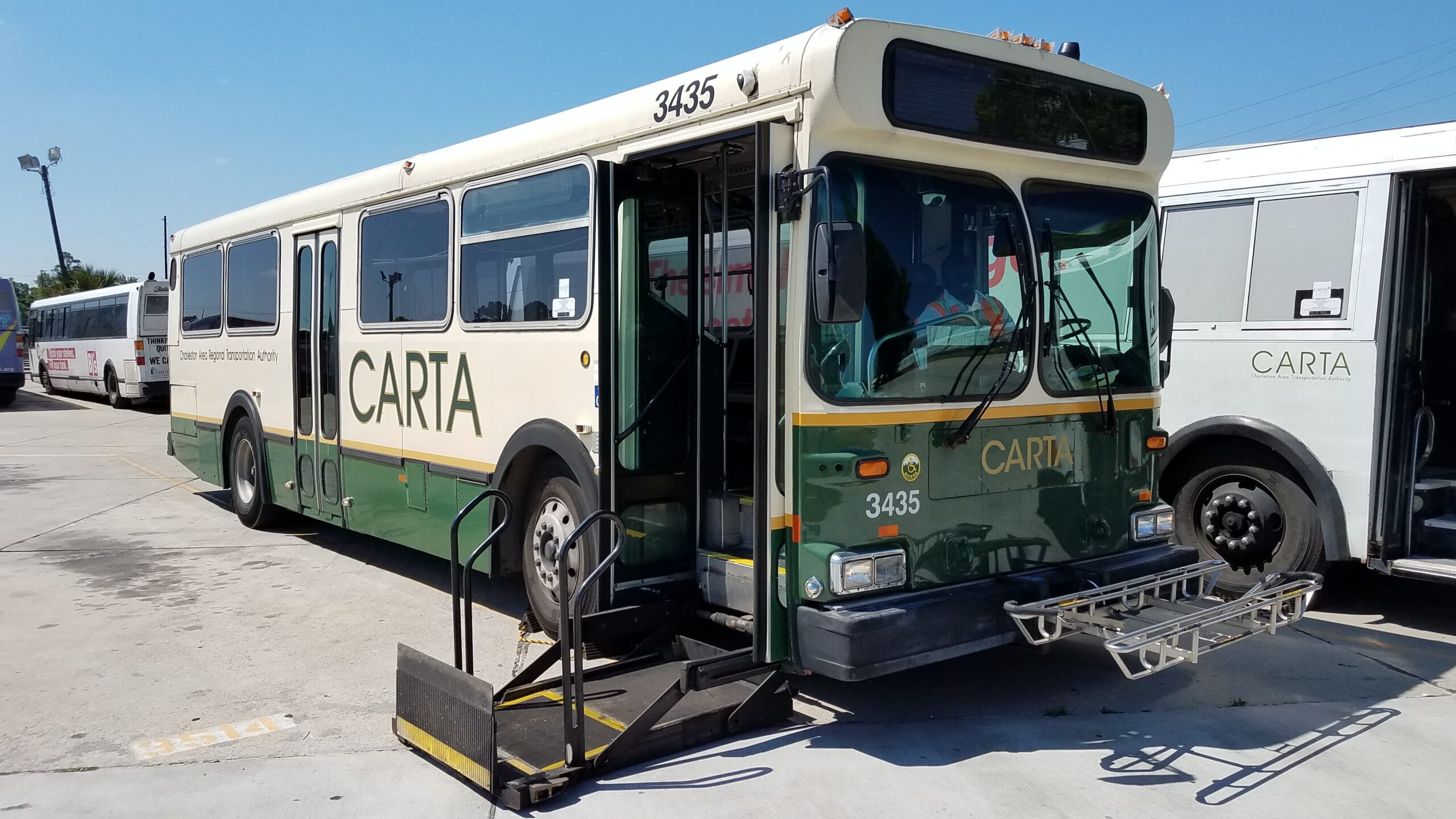 Charleston d35hf bus with wheelchair lift deployed and bike rack unfolded at Harbor View AFH in Tacoma, WA